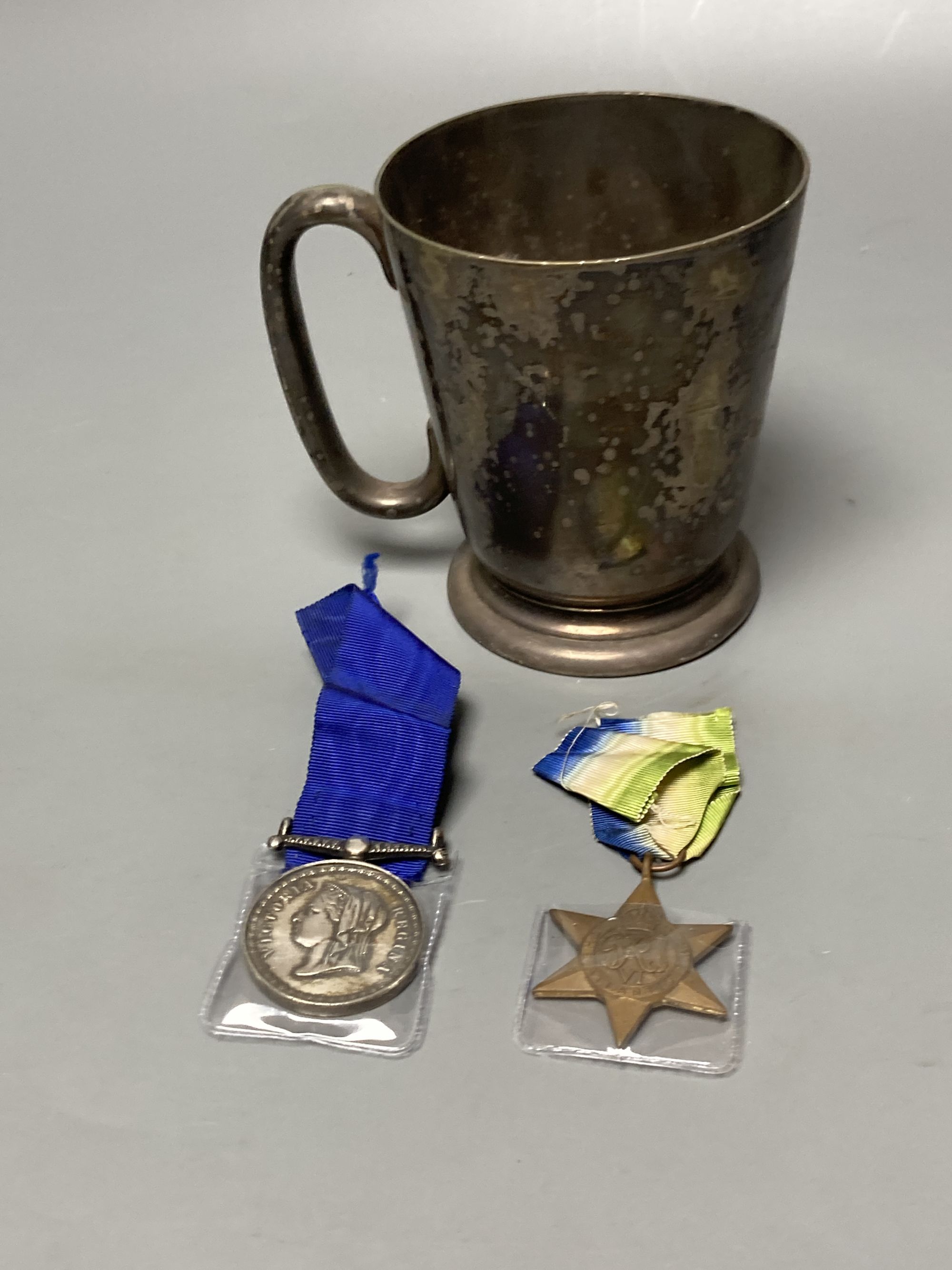 Militaria to include a Victorian Volunteer Rifles shooting medal, a WWII Atlantic Star and a plated mug engraved to 'Champion-at-Arms 1940 S/Sgt H. E. Malpas'